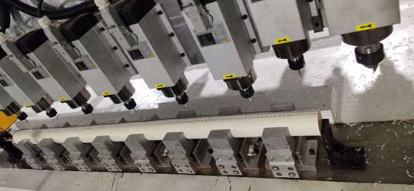 8 piece spindle working at same time to make hole at same level 